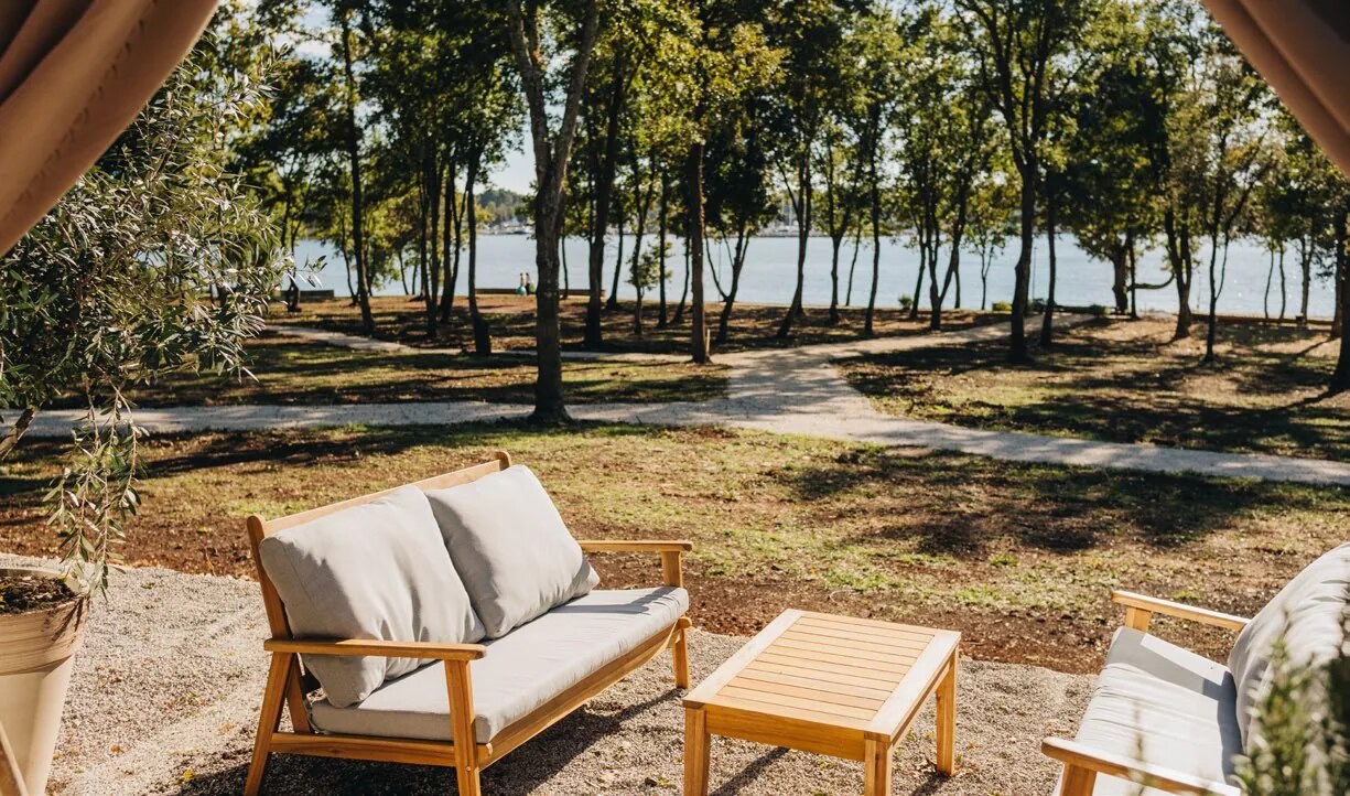 Outdoor lounge beneath the trees in the garden